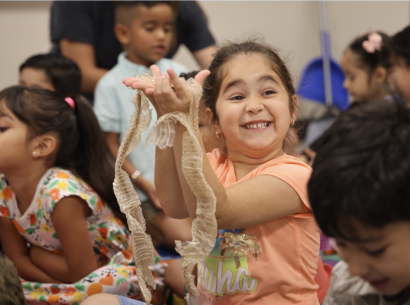  Mendez students holds up Snake Skin in her Science class 